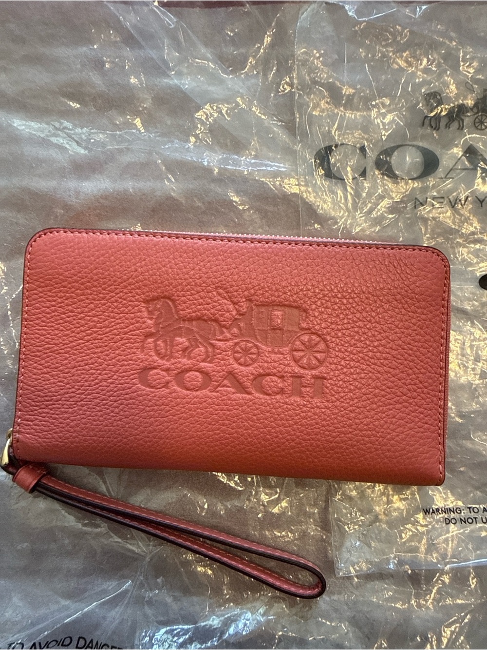Coach Embossed Leather Wristlet in Coral